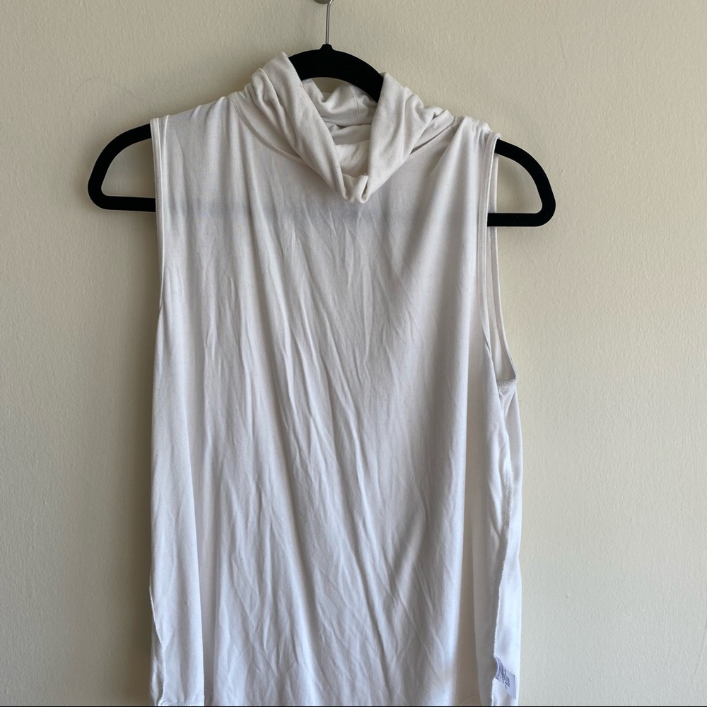White sleeveless turtle neck